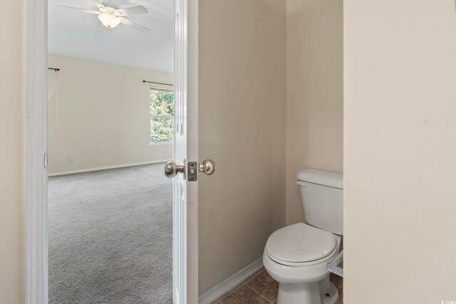 bathroom featuring ceiling fan and toilet