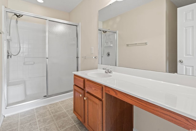 bathroom featuring walk in shower and vanity