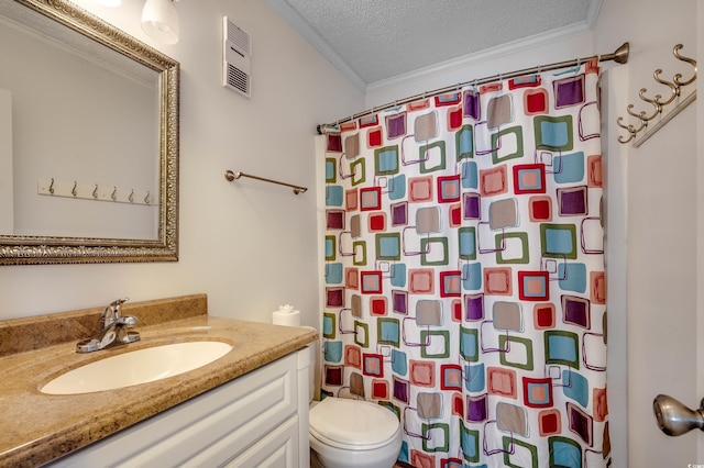 bathroom with a textured ceiling, crown molding, vanity, and toilet