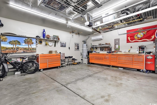 garage featuring a garage door opener, water heater, a wall unit AC, a workshop area, and electric panel