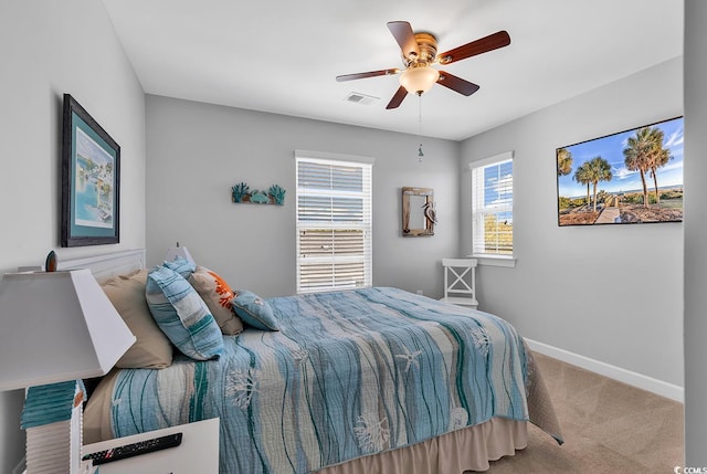 bedroom with light colored carpet and ceiling fan