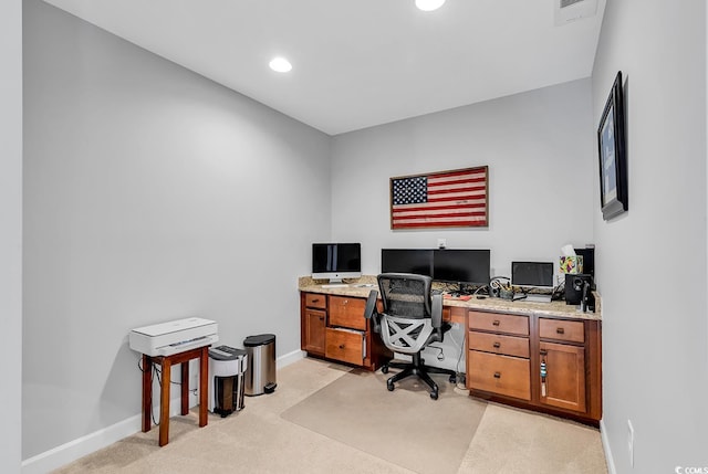 home office with light colored carpet