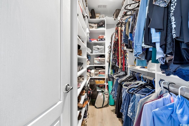 walk in closet featuring light hardwood / wood-style floors