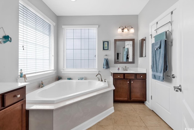 bathroom featuring vanity, a tub, and tile patterned floors