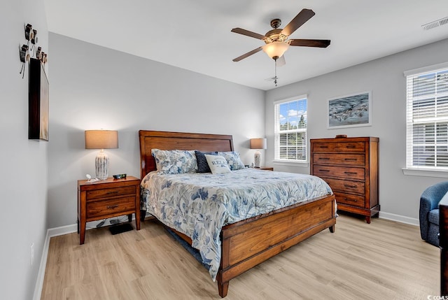 bedroom featuring light hardwood / wood-style floors and ceiling fan