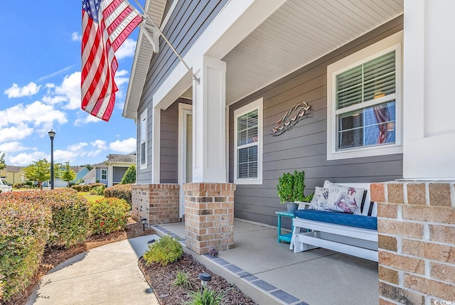 property entrance with covered porch