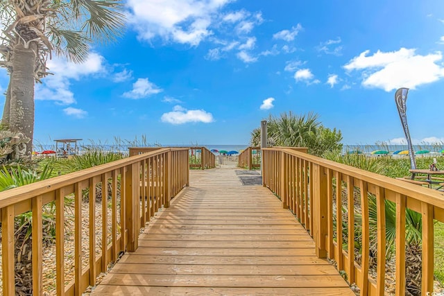 surrounding community featuring a water view