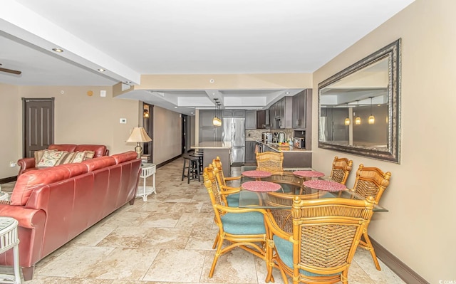 201 74th Ave N Unit 1002, Myrtle Beach, SC 29572 - dining room featuring baseboards and light stone finish floors