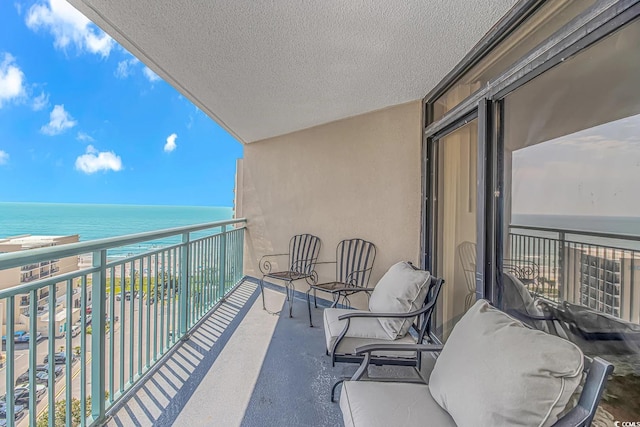 balcony featuring a water view