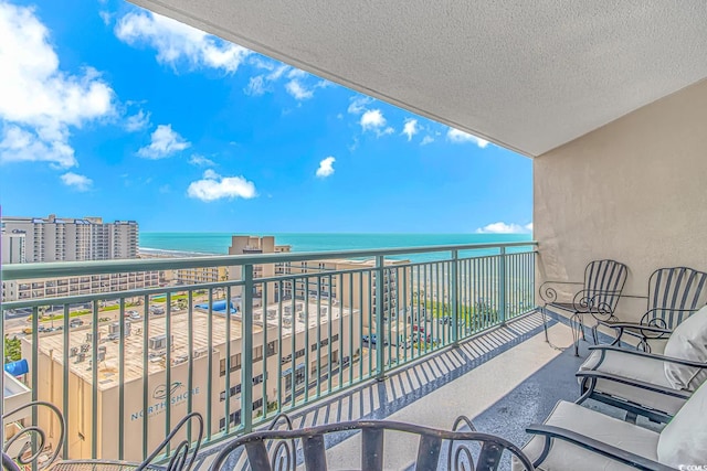 balcony featuring a water view