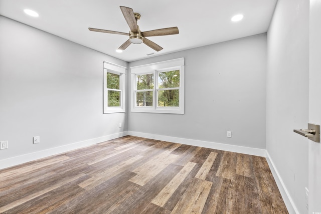 empty room with baseboards, wood finished floors, ceiling fan, and recessed lighting