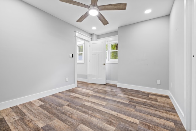 unfurnished room featuring baseboards, wood finished floors, recessed lighting, and a ceiling fan