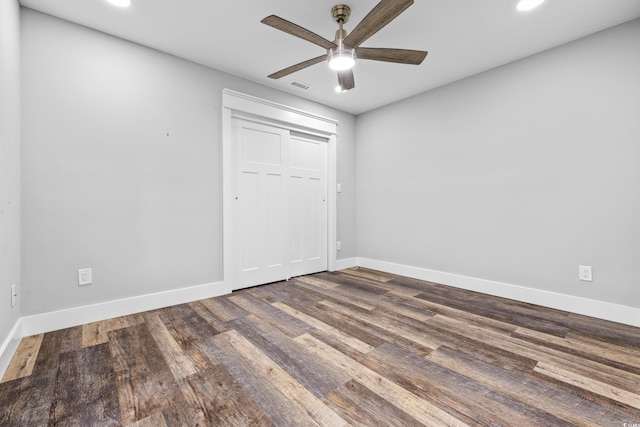 empty room featuring recessed lighting, baseboards, ceiling fan, visible vents, and wood finished floors