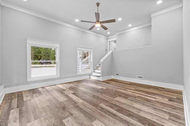 unfurnished living room with visible vents, baseboards, ceiling fan, wood finished floors, and recessed lighting