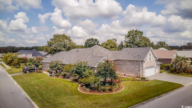 exterior space featuring a garage and a front yard