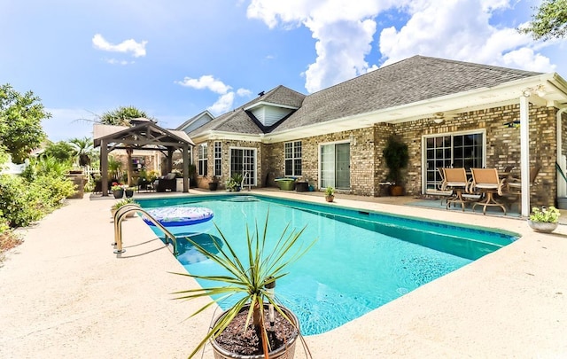 view of swimming pool featuring a gazebo and a patio