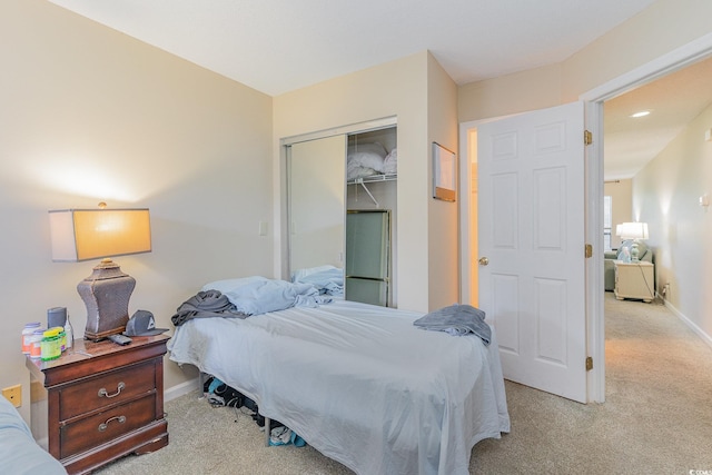 carpeted bedroom with a closet