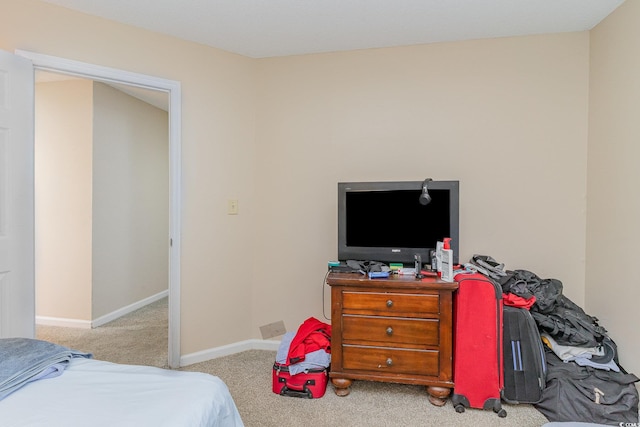 bedroom with light colored carpet