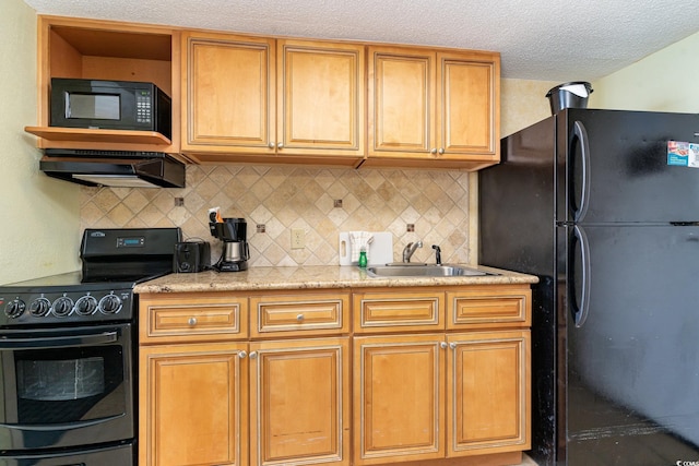 kitchen featuring black appliances, a textured ceiling, sink, and decorative backsplash