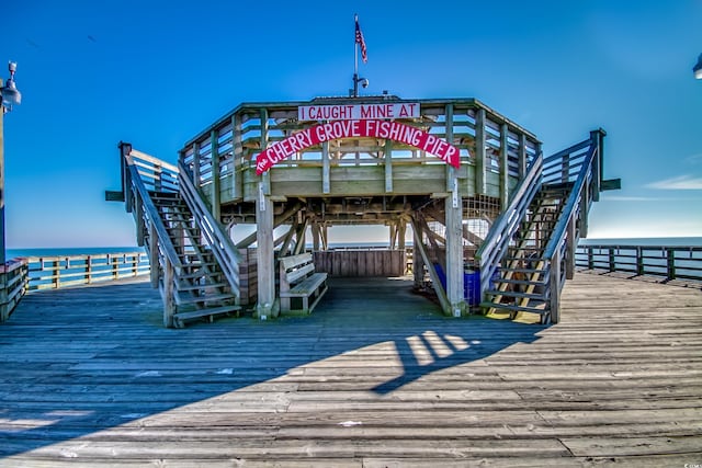 dock area featuring a water view and stairs