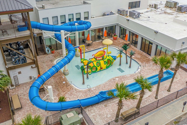 exterior space featuring a community pool and a patio