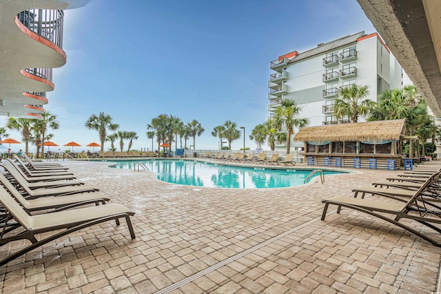 view of swimming pool with a patio