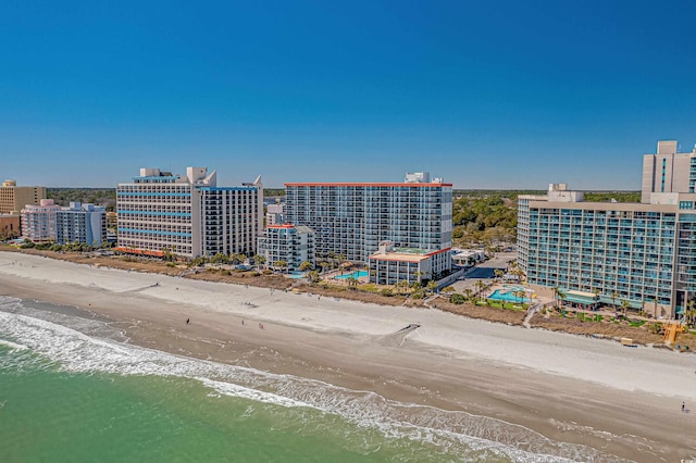 birds eye view of property with a view of the beach and a water view