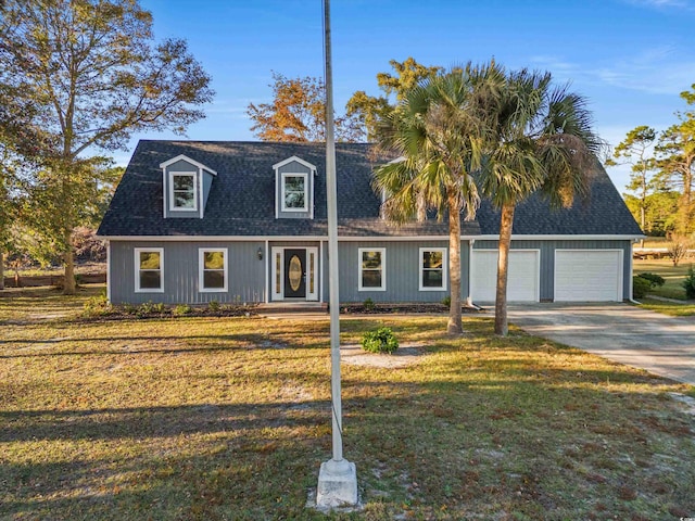 cape cod home with a front lawn and a garage