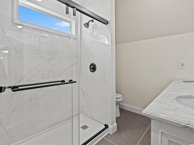 bathroom featuring vanity, tile patterned floors, an enclosed shower, and toilet