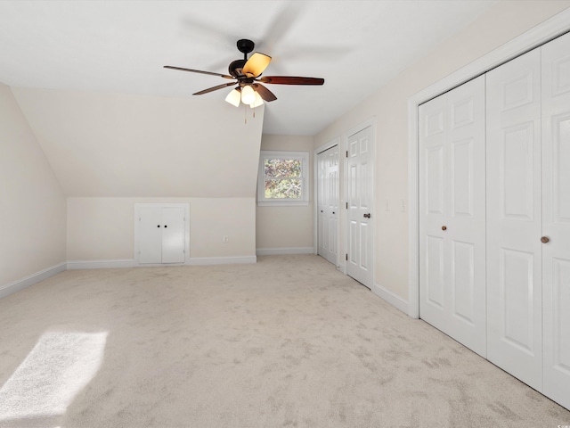 bonus room featuring lofted ceiling, ceiling fan, and light colored carpet