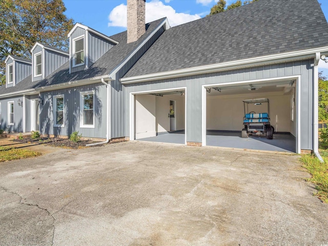 back of house featuring a garage