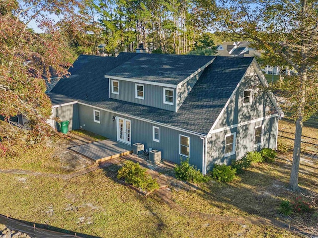 view of front of home featuring central AC and french doors