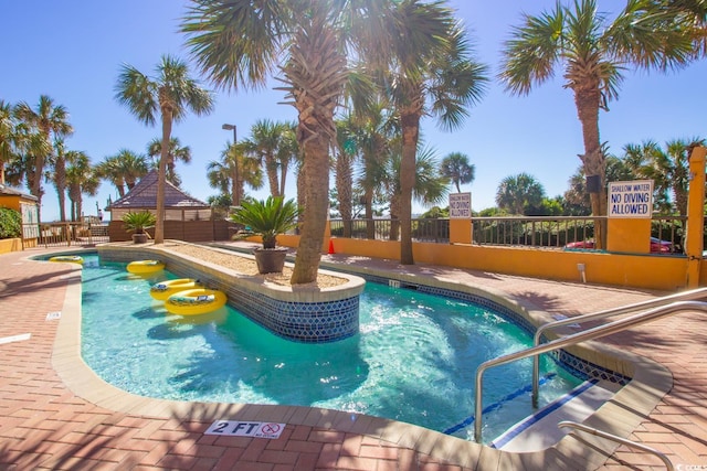 view of pool featuring a patio