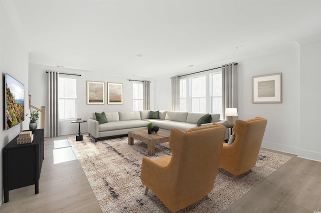 living room with a wealth of natural light, baseboards, light wood-style flooring, and crown molding