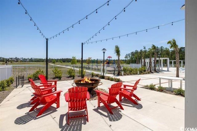 view of patio / terrace featuring a fire pit