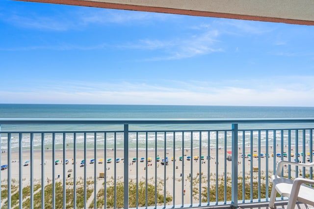 exterior space featuring a view of the beach and a water view