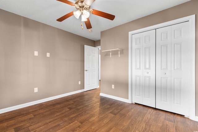 unfurnished bedroom featuring a closet, ceiling fan, and dark hardwood / wood-style flooring