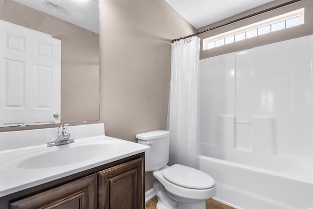 full bathroom with vanity, toilet, and shower / tub combo with curtain