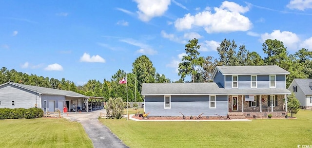 view of front of house with a front lawn and a carport