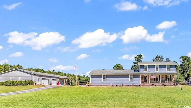 3747 Bakers Chapel Rd, Aynor, SC 29511 - view of front of house with a garage, a front lawn, and a porch