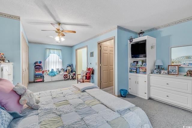 bedroom with ceiling fan, ornamental molding, light carpet, and a textured ceiling