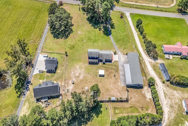 birds eye view of property featuring a rural view