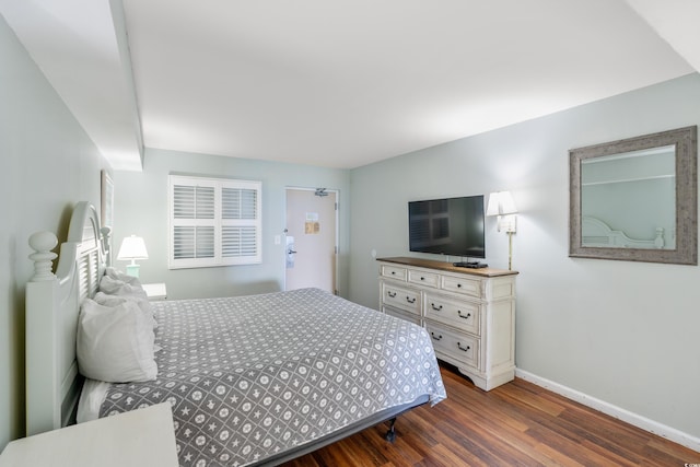 bedroom featuring dark hardwood / wood-style flooring