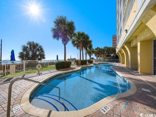 view of swimming pool with a patio area