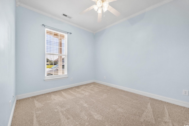 unfurnished room featuring ceiling fan, ornamental molding, and light carpet