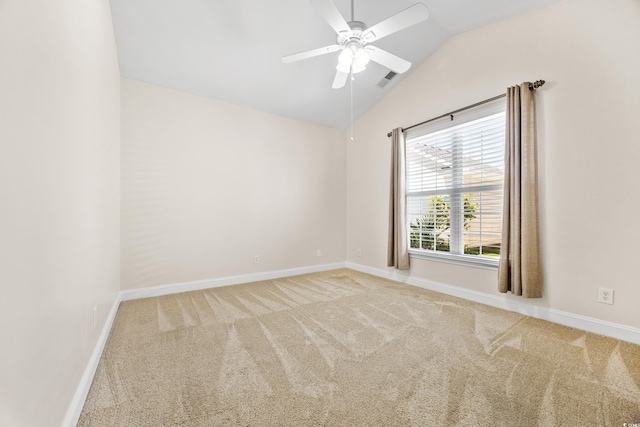 unfurnished room featuring ceiling fan, light carpet, and vaulted ceiling