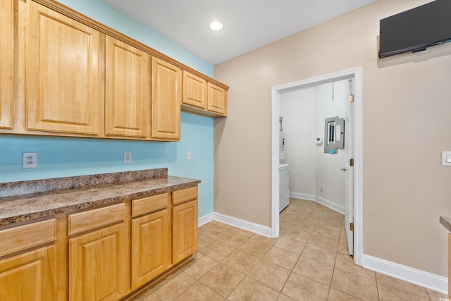 kitchen featuring electric panel and light tile patterned flooring