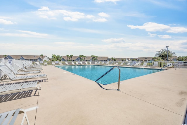 view of swimming pool with a patio area