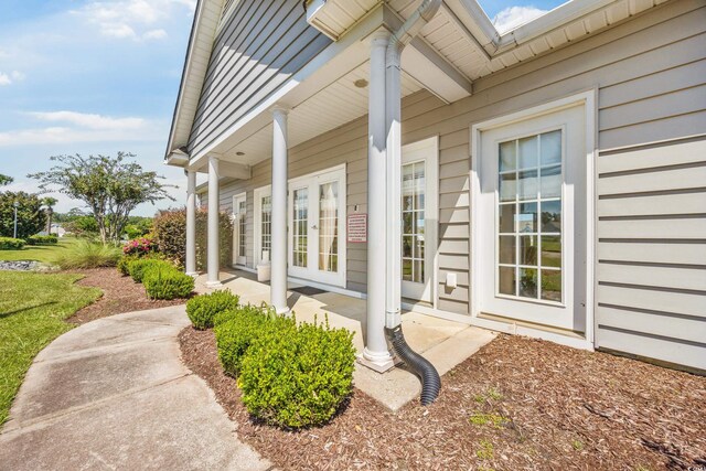 view of side of property featuring a porch