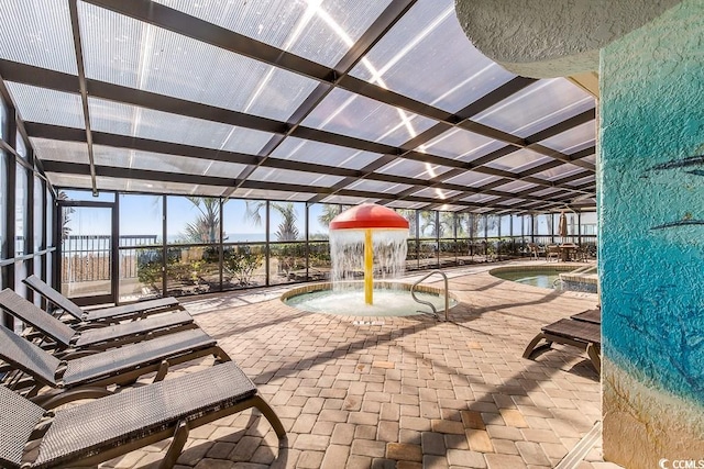 interior space featuring glass enclosure, pool water feature, and an indoor pool